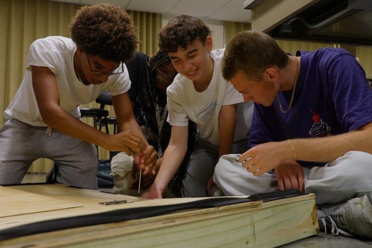 Students working together to build a structure in class