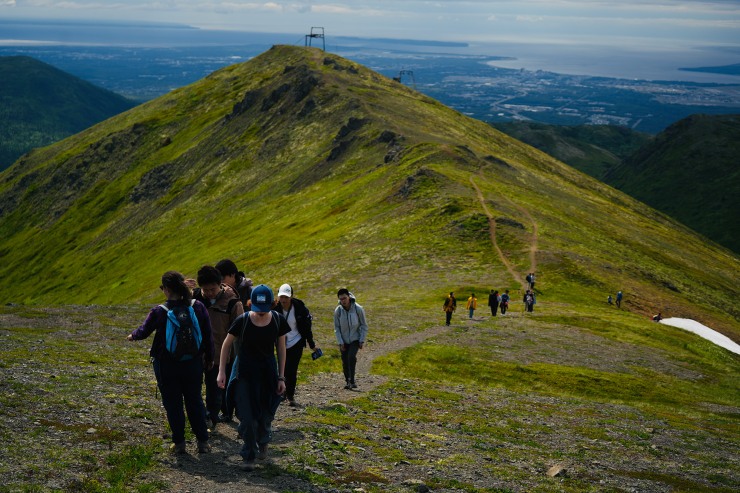 people walking along a mountain ridge in Alaska