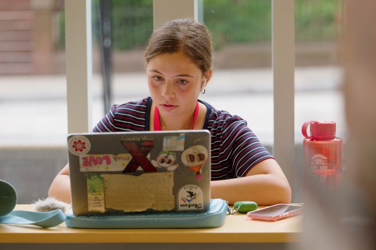 student working on a laptop