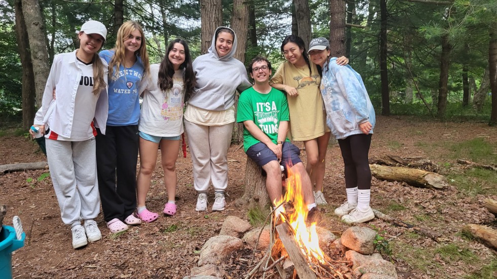 BELL Rhode Island students posing in front of a campfire