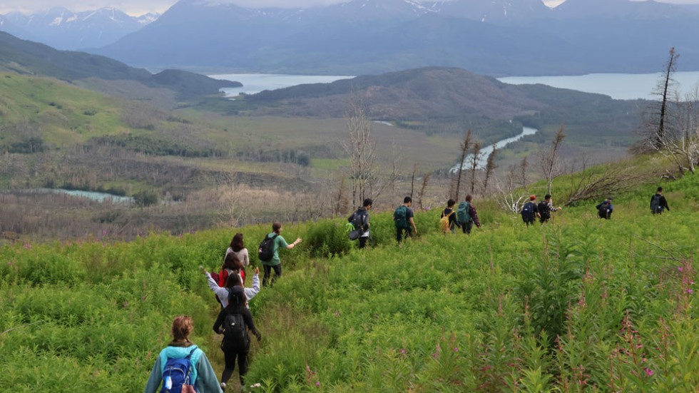 BELL Alaska students hiking through a landscape