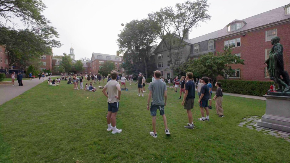 students playing sports on the main green of Brown University