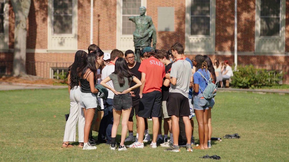 Seasonal staff member working with their orientation group.