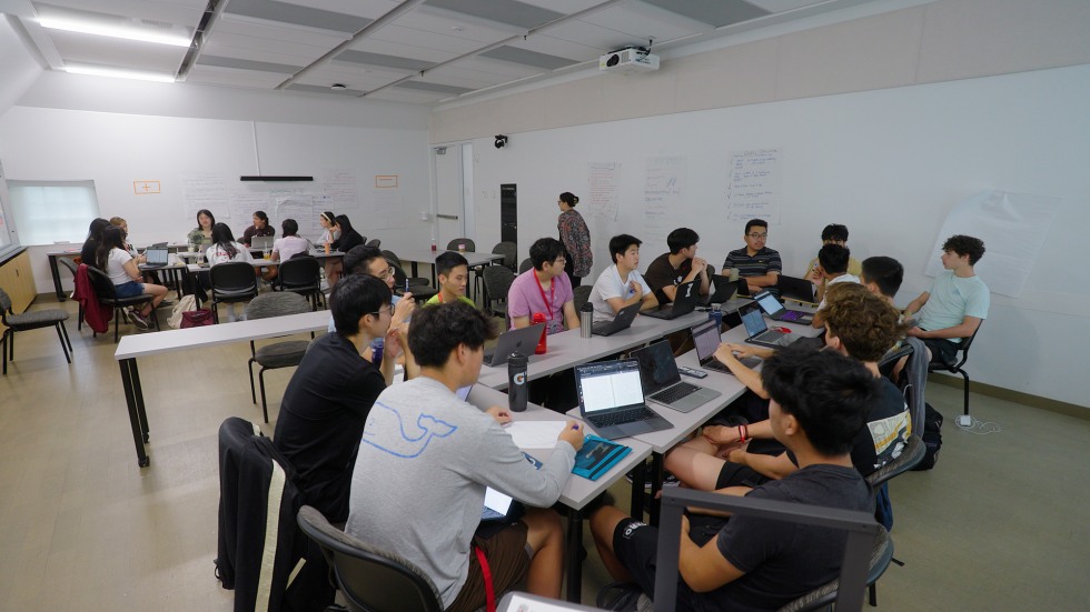 a table of students partaking in a class discussion
