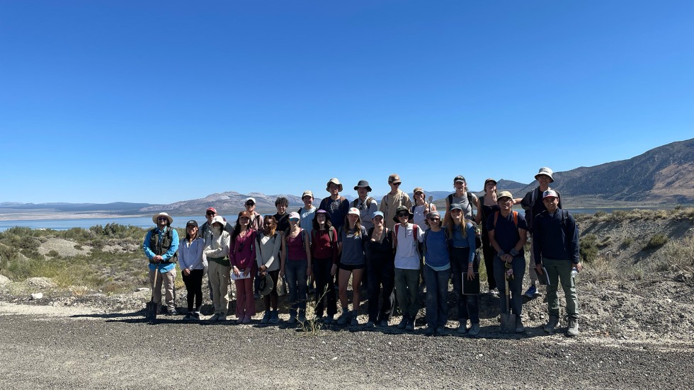 BELL students posing in front of a mountain range