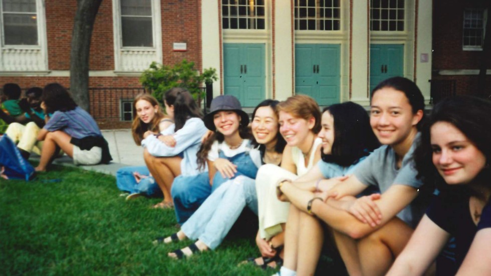 a group of students socializing on the lawn at Brown University