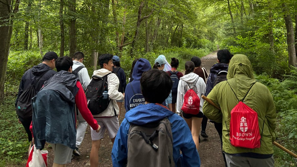 BELL RI students walking in the woods