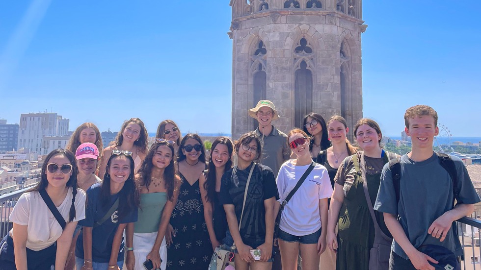 students standing in front of a historic building