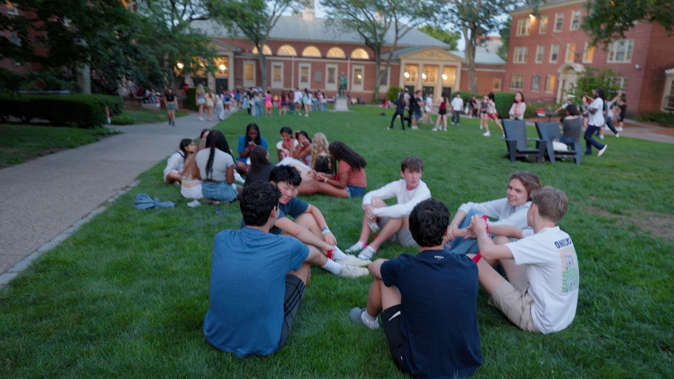 students hanging out in the grass at Brown University