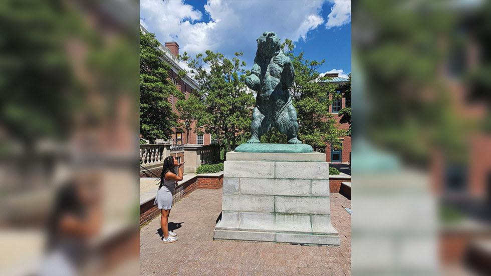 Brielle standing next to the Bronze Bruno statue