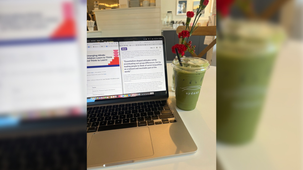 Laptop and matcha beverage on a table in a cafe